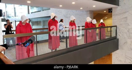 Washington DC, USA. 4th September 2018. Washington DC, September 3, 2018, USA: Protestors dressed as 'Hand Maidens' line the hallway near the Judge Brett Kavanaugh nomination hearing to become the next Associate Supreme Court Justice. The protestors are concerned that Kavanaugh may try and overturn Roe V Wade.  Patsy Lynch/Alamy Credit: Patsy Lynch/Alamy Live News Stock Photo