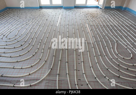 installation of underfloor heating in new built house Stock Photo