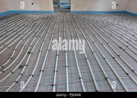 installation of underfloor heating in new built house Stock Photo
