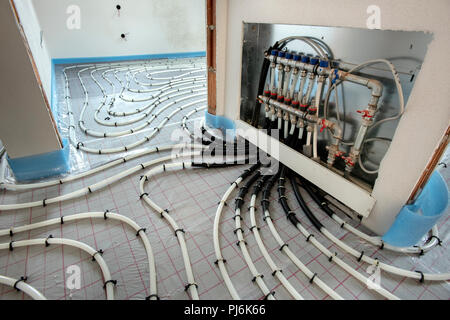 installation of underfloor heating in new built house Stock Photo