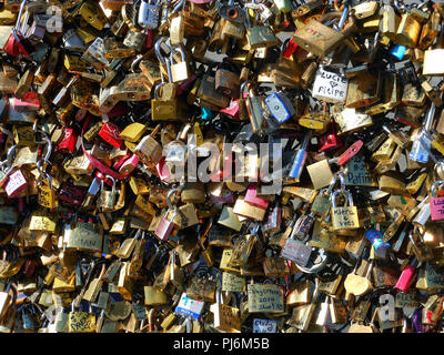 Hundreds of Padlocks and messages fixed to a bridge over the River Liffey in Dublin Ireland. Stock Photo