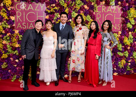 (From left to right) Ken Jeong, Constance Wu, Henry Golding, Gemma Chan, Awkwafina and Jing Lusi attending the Crazy Rich Asians Premiere held at Ham Yard Hotel, London. Stock Photo