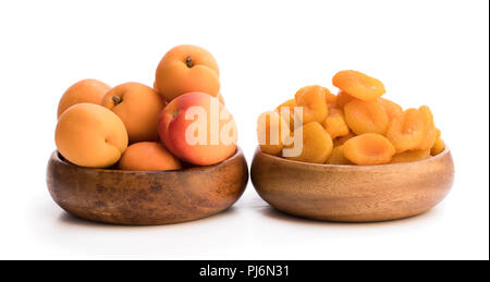 Fresh  and dried apricot in wooden bowls Stock Photo