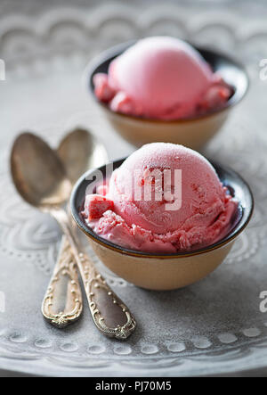 Homemade organic fruit ice cream scoops in two bowls Stock Photo