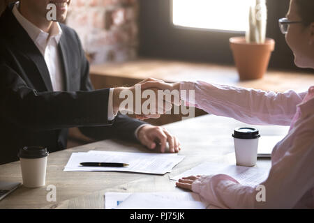 Close up handshake of two successful businesspeople after good deal Stock Photo