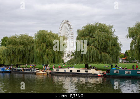 Ferris wheel and river Avon with canal barges, Stratford Upon Avon, Warwickshire, England. Stock Photo