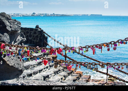 Love locks in Playa Dorada beach in Playa Blanca, Lanzarote, Canary islands Stock Photo