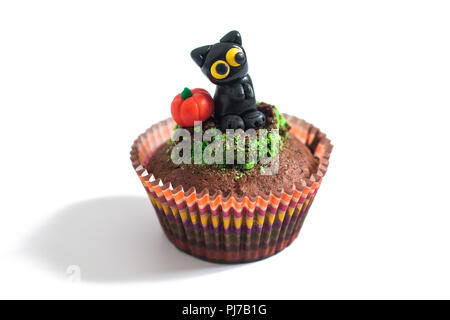 Halloween Holiday food colorful fancy brownies cupcake with black cat and pumpkin fondant decorate on white background Stock Photo