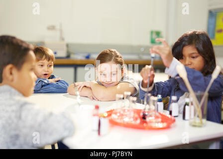 Curious kids conducting science experiment Stock Photo