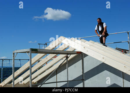 Carpenter working in roof in Lictenwald, Germany Stock Photo
