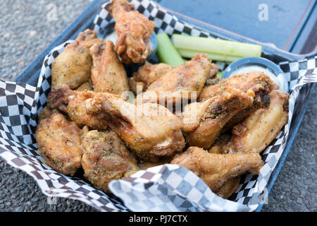 Black pepper Buffalo wings chicken in basket Stock Photo