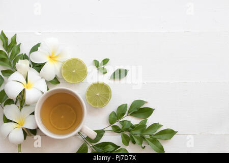 herbal health care hot mix honey lemon cough sore with flower frangipani on background white Stock Photo