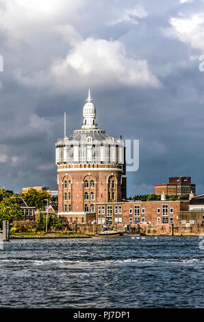 Rotterdam, The Netherlands, August 13, 2018: The old water tower at the Esch, dating back to 1873, as seen from the river Nieuwe Maas Stock Photo