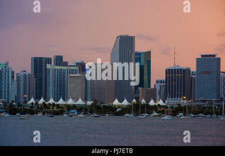 MIAMI, FLORIDA - CIRCA SEPTEMBER 2017: View of Downtown Miami, the Miami Seaport and Biscayne Bay at Sunset