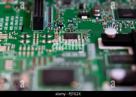 Lcd tv electronic circuit. Green color, faded at the sides. Stock Photo