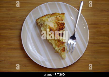 Apple pie on plate with fork. Traditional autumns cake dessert. Stock Photo
