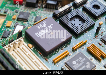 An Intel i486 SX (80486SX) processor (CPU) from 1989 in a socket on a motherboard. Caklov, Slovakia. 2018/7/28. Stock Photo