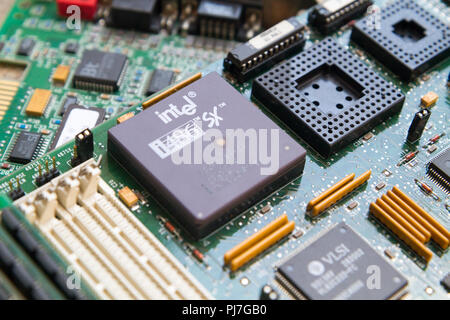An Intel i486 SX (80486SX) processor (CPU) from 1989 in a socket on a motherboard. Caklov, Slovakia. 2018/7/28. Stock Photo