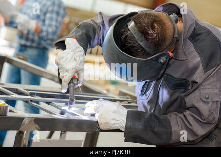Man welding metal Stock Photo
