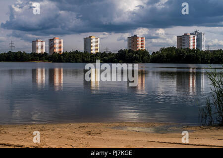 Lake with Block Buildings in the Background Stock Photo