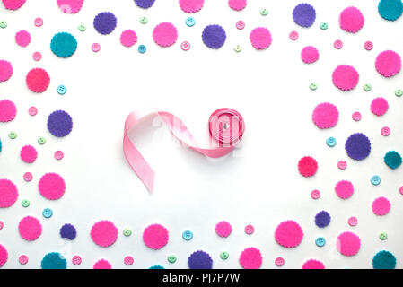 Colored confetti satin ribbon on a white background. Top view flat lay Stock Photo