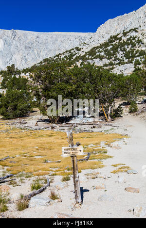 A trail sign marking the way to ruby lake and Mono Pass in the Eastern Sierra Nevada Mountains of California USA