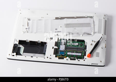 Gimpo-si, Korea - July 10, 2018: Access panel with DDR3L RAM and M.2 sata SSD on the bottom of a laptop, which has SATA slot, RAM slots and sata M.2 s Stock Photo