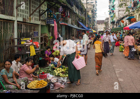 Yangon, Myanmar - September 27, 2016: Traditional burmese street market in Yangon. Stock Photo