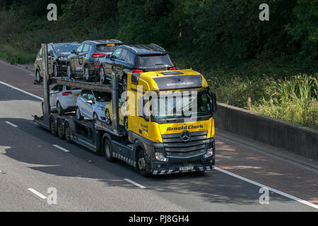 2014 Mercedes-Benz Actros Arnold Clarke car transporter, Lorries & Trucks, shipping freight, heavy haulage, lorry logistics, delivery transport vehicles on the M6 at Lancaster, UK Stock Photo