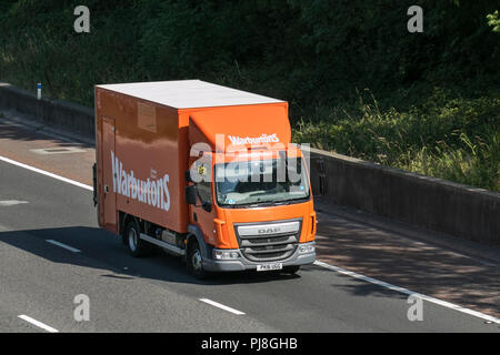 Warburtons food transport Trucks, shipping freight, heavy haulage, lorry logistics delivery transport vehicles on the M6 at Lancaster, UK Stock Photo