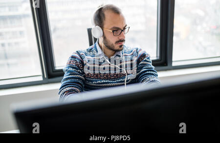 Software engineer programming in office Stock Photo