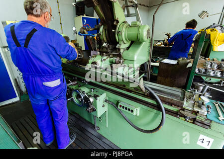 Two technicians working in factory Stock Photo