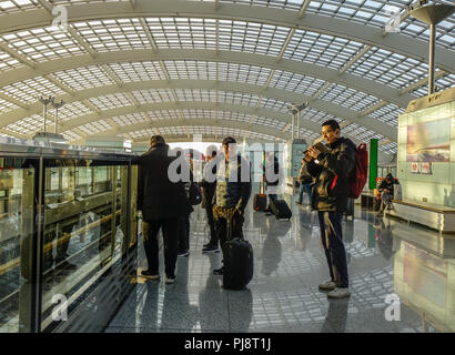 Beijing, China - Mar 1, 2018. Passengers waiting at train station in Beijing Capital Airport. The Airport (PEK) is situated 32 km northeast of central Stock Photo