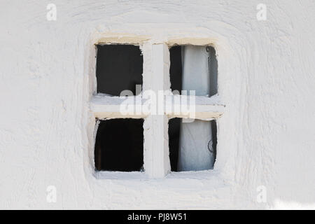 Fragment of the wall and the old closed window, close-up Stock Photo