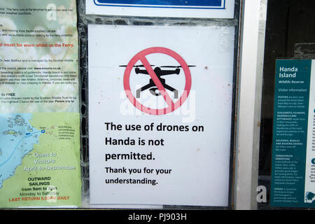 Scotland. Sutherland. Tarbet. Sign warning that drones are not permitted on Handa island, a nature reserve Stock Photo