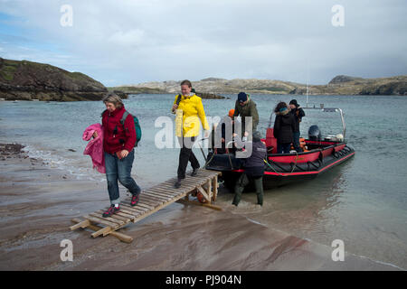 Scotland. Sutherland. Ferry to Handa Island from Tarbet. Disembarking. Stock Photo