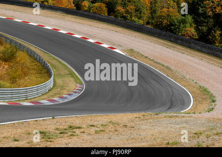 View on empty race track circuit with red white curbs motorsport concept racing background Stock Photo