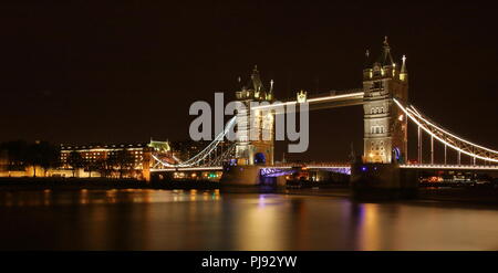 Night cityscape, skyline of London Bridge in London, illuminated, black sky, river thames, long time exposure. Stock Photo