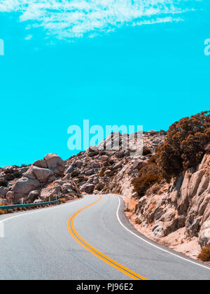 Twisting road through the mountains Stock Photo