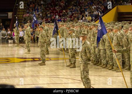 More than 400 Arizona Army National Guard Soldiers with 1st Battalion, 158th Infantry Regiment rally together with their families inside Wells Fargo Arena in Tempe, Arizona for an emotional farewell ceremony July 7, as the Battalion prepares for their deployment in support of Operation Spartan Shield Stock Photo