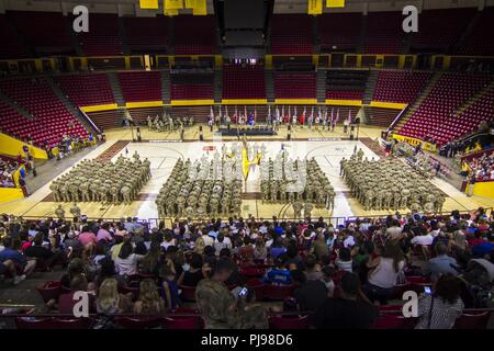 More than 400 Arizona Army National Guard Soldiers with 1st Battalion, 158th Infantry Regiment rally together with their families inside Wells Fargo Arena in Tempe, Arizona for an emotional farewell ceremony July 7, as the Battalion prepares for their deployment in support of Operation Spartan Shield Stock Photo