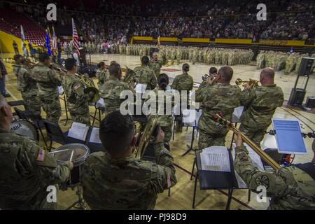 More than 400 Arizona Army National Guard Soldiers with 1st Battalion, 158th Infantry Regiment rally together with their families inside Wells Fargo Arena in Tempe, Arizona for an emotional farewell ceremony July 7, as the Battalion prepares for their deployment in support of Operation Spartan Shield Stock Photo