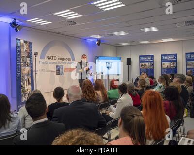 BRUSSELS (July 12, 2018) – U.S. Army Maj. Gen. William Hickman, deputy chief of staff, Strategic Plans and Policy, Supreme Allied Command Transformation, briefs participants attending the Inclusive Security breakout session during the “NATO Engages: Brussels Summit Dialogue” at the NATO Summit 2018. The event included a formal presentation on NATO’s Concept for the Protection of Civilians and provided a hands-on demonstration of the new immersive training environment supporting the recently approved concept. NATO’s Concept for the Protection of Civilians aims to set out a coherent, consistent  Stock Photo