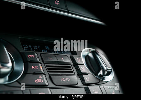 Air conditioning button inside a car. Climate control AC unit in the new car. Modern car interior details. Car detailing. Stock Photo