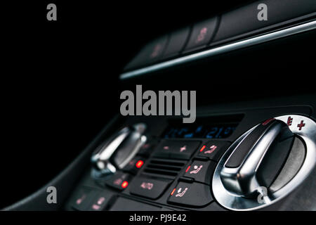Air conditioning button inside a car. Climate control AC unit in the new car. Modern car interior details. Car detailing. Stock Photo