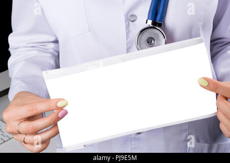 Blank empty Electrocardiogram screen in hand of a female doctor. Medical health care. Clinic cardiology heart rhythm and pulse test closeup. Cardiogra Stock Photo