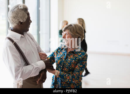 Active senior couple dancing in dance class Stock Photo