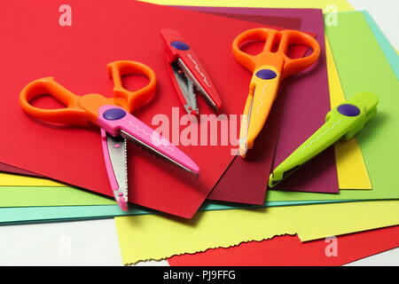 Decorative scissors and colorful cartons for crafts Stock Photo