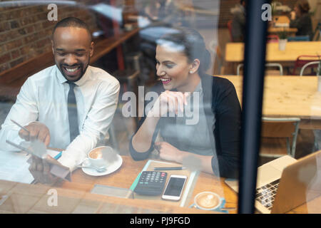 Business people working at cafe window Stock Photo