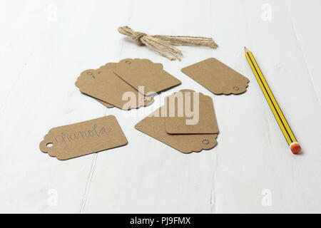 Carton tags on white surface Stock Photo